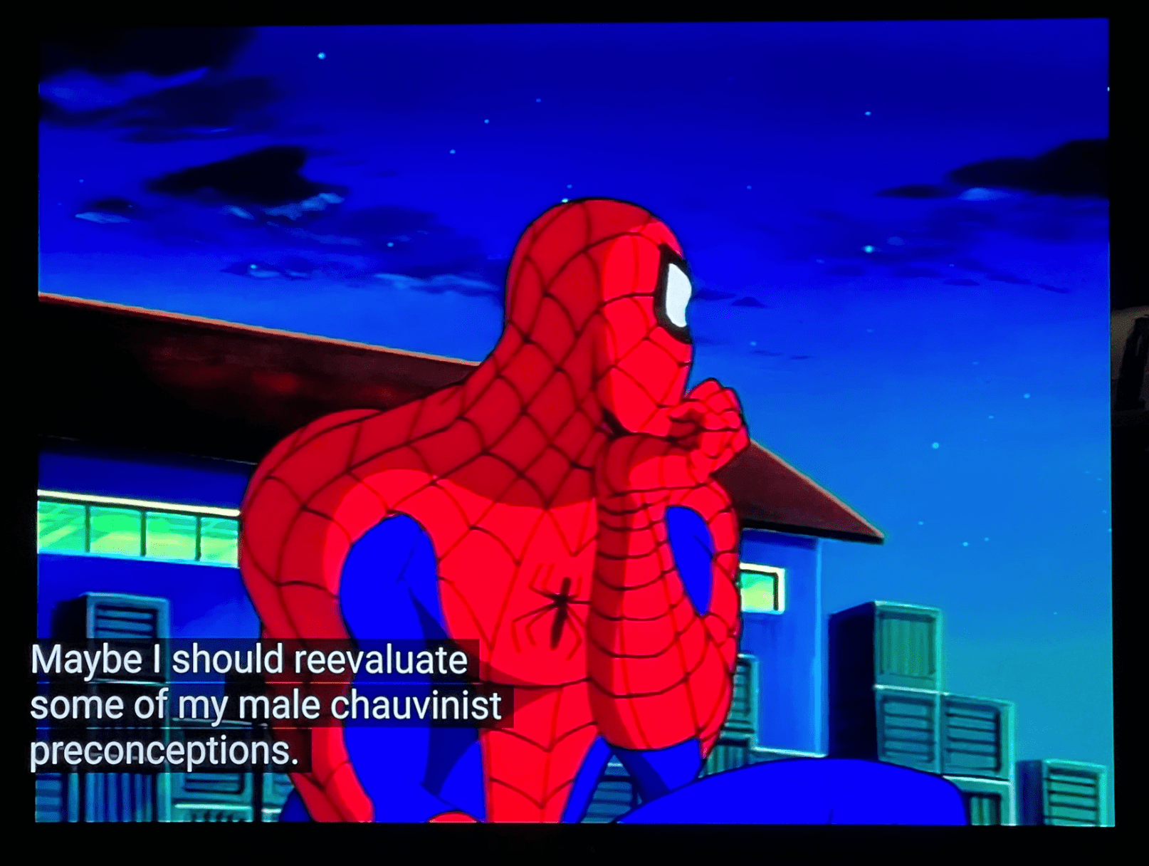 Screenshot of an old Spider-Man cartoon. Spider-Man looks off in the distance, and the closed captioning reads "Maybe I should reevaluate my male chauvinist preconceptions."